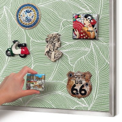 Souvenir magnet display board with a silver frame Tropical leaves