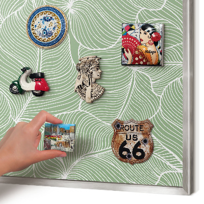 Souvenir magnet display board with a silver frame Tropical leaves