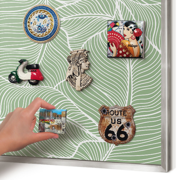 Souvenir magnet display board with a silver frame Tropical leaves