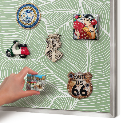 Souvenir magnet display board with a silver frame Tropical leaves