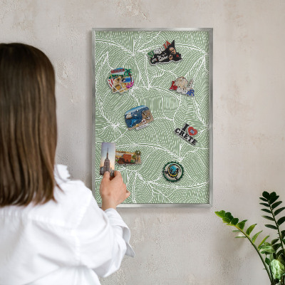 Souvenir magnet display board with a silver frame Tropical leaves