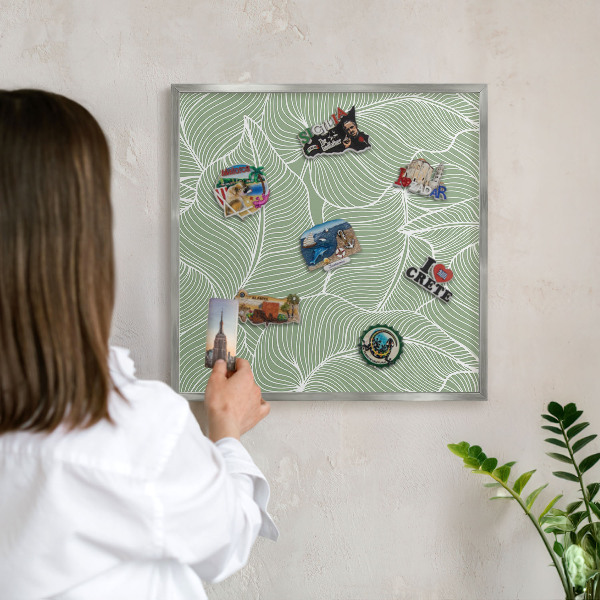 Souvenir magnet display board with a silver frame Tropical leaves