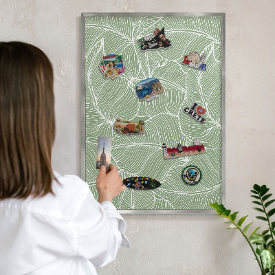 Souvenir magnet display board with a silver frame Tropical leaves