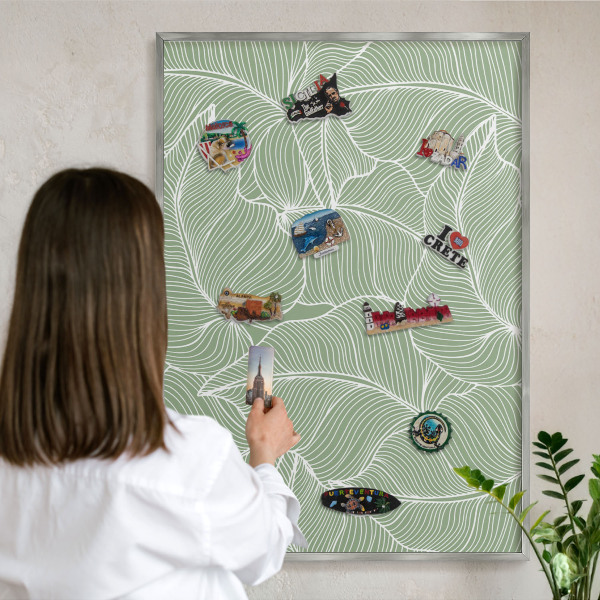 Souvenir magnet display board with a silver frame Tropical leaves