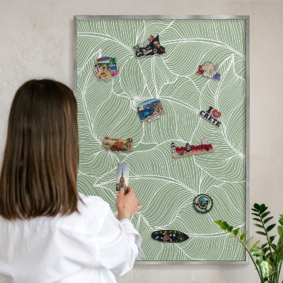 Souvenir magnet display board with a silver frame Tropical leaves