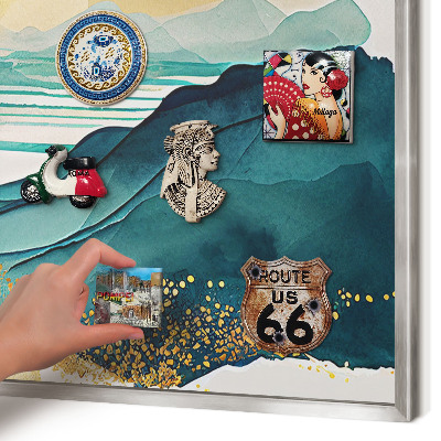 Souvenir magnet display board with a silver frame A peaceful view