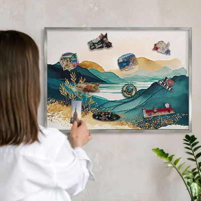 Souvenir magnet display board with a silver frame A peaceful view