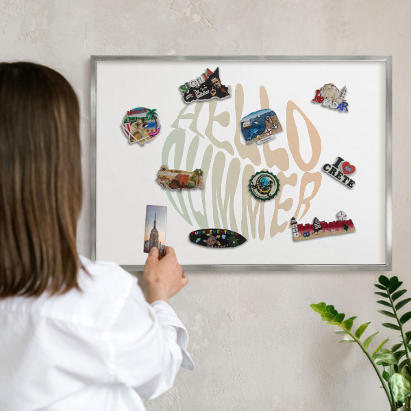 Souvenir magnet display board with a silver frame Hello summer