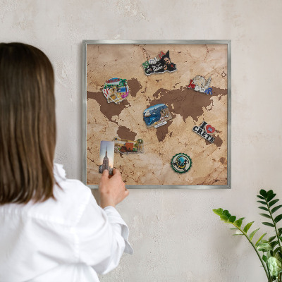 Souvenir magnet display board with a silver frame World map