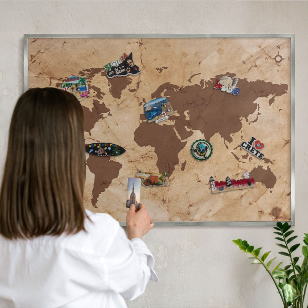 Souvenir magnet display board with a silver frame World map