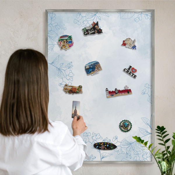 Souvenir magnet display board with a silver frame Floristic elegance