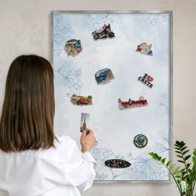 Souvenir magnet display board with a silver frame Floristic elegance
