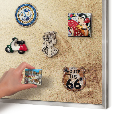 Souvenir magnet display board with a silver frame Sand leaves