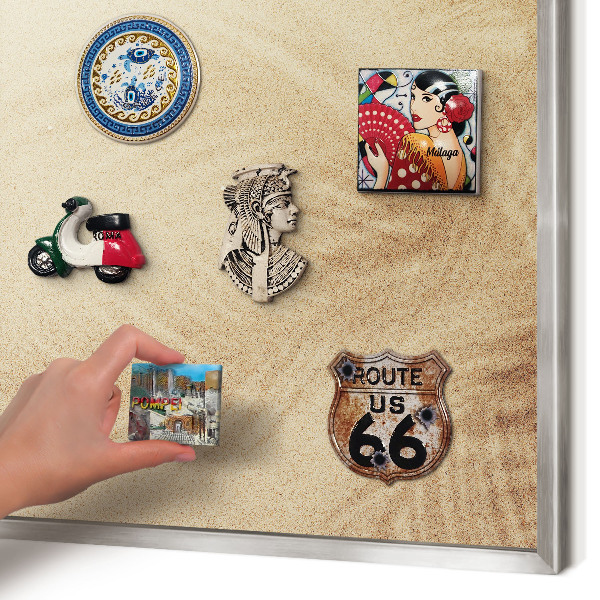 Souvenir magnet display board with a silver frame Sand leaves