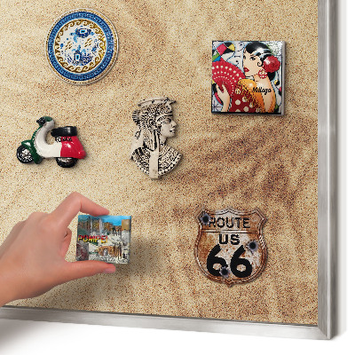 Souvenir magnet display board with a silver frame Sand leaves