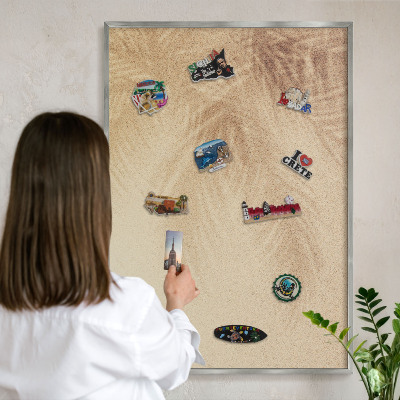 Souvenir magnet display board with a silver frame Sand leaves