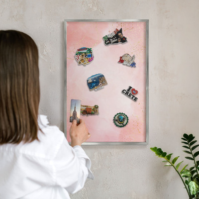 Souvenir magnet display board with a silver frame Subtle elegance