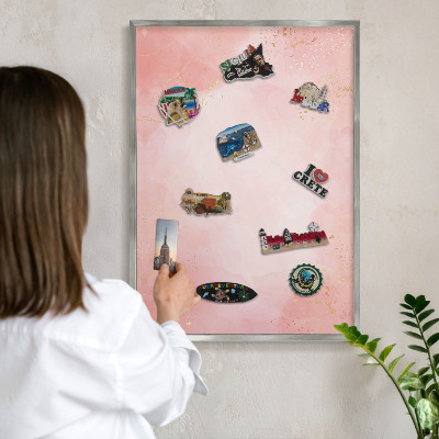 Souvenir magnet display board with a silver frame Subtle elegance