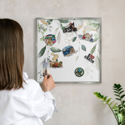 Souvenir magnet display board with a silver frame Green leaves