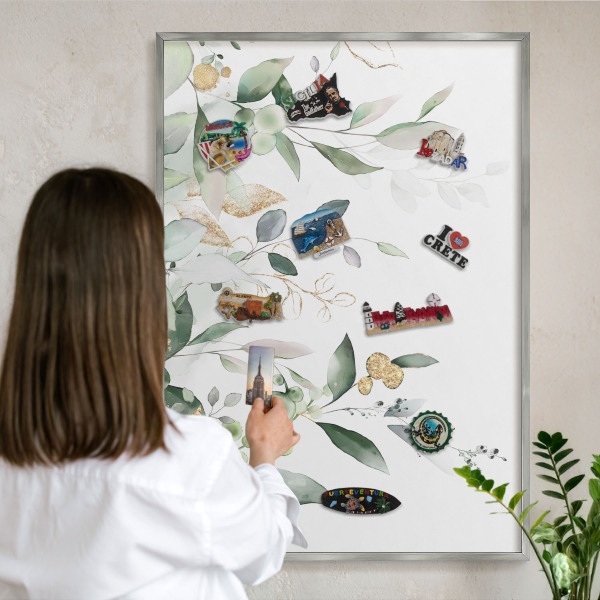 Souvenir magnet display board with a silver frame Green leaves
