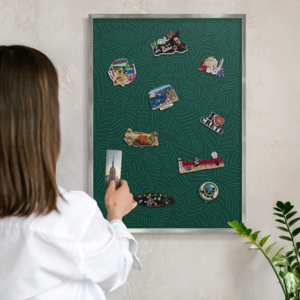 Souvenir magnet display board with a silver frame Green leaves