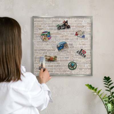 Souvenir magnet display board with a silver frame Brick pattern