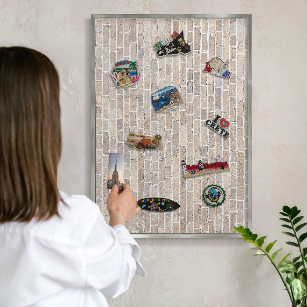 Souvenir magnet display board with a silver frame Brick pattern