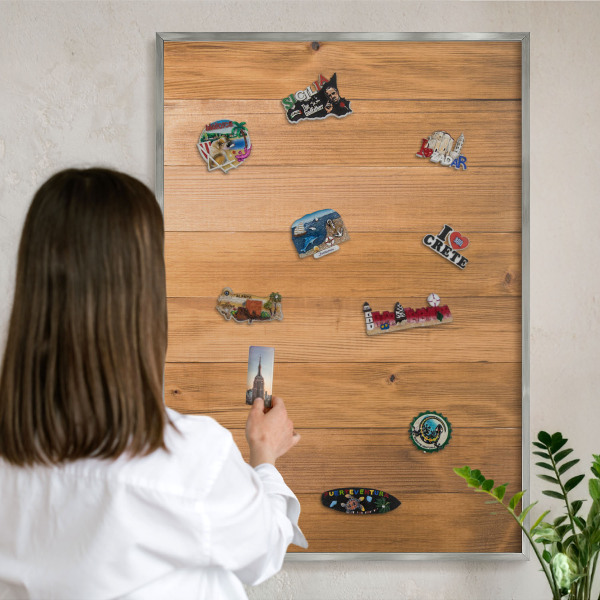 Souvenir magnet display board with a silver frame Wooden texture