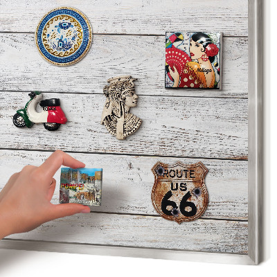Souvenir magnet display board with a silver frame Rustic wood