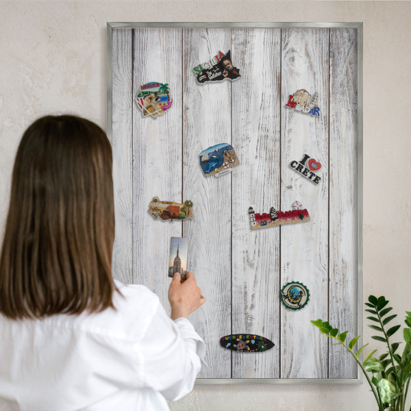 Souvenir magnet display board with a silver frame Rustic wood