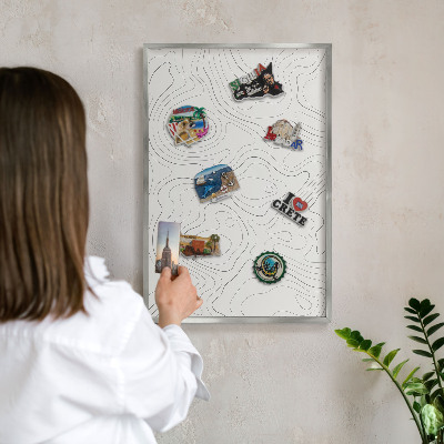 Souvenir magnet display board with a silver frame Geometric elegance