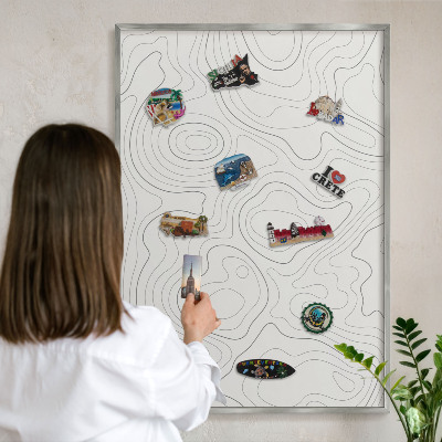 Souvenir magnet display board with a silver frame Geometric elegance