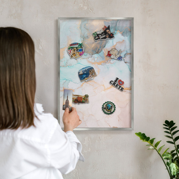 Souvenir magnet display board with a silver frame Pastel forms