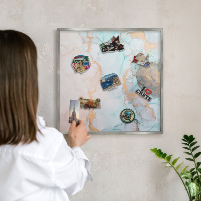 Souvenir magnet display board with a silver frame Pastel forms