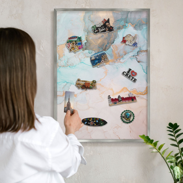 Souvenir magnet display board with a silver frame Pastel forms