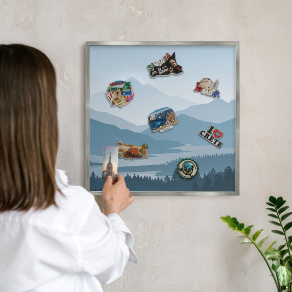 Souvenir magnet display board with a silver frame Mountain harmony