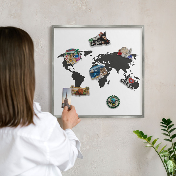 Souvenir magnet display board with a silver frame World map
