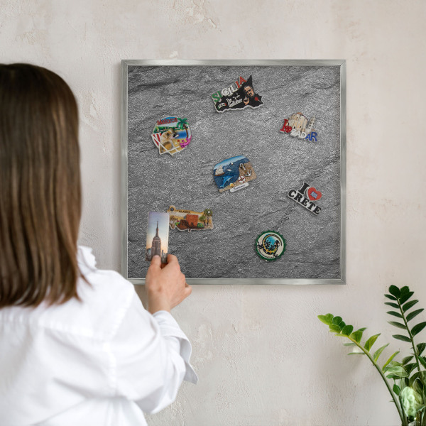 Souvenir magnet display board with a silver frame Gray stone