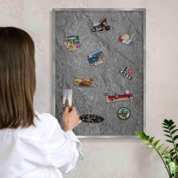 Souvenir magnet display board with a silver frame Gray stone