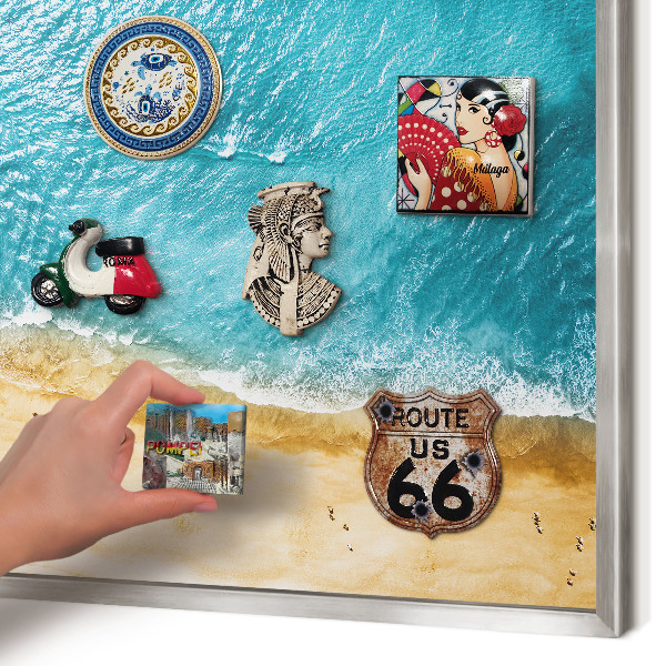Souvenir magnet display board with a silver frame Sea and beach