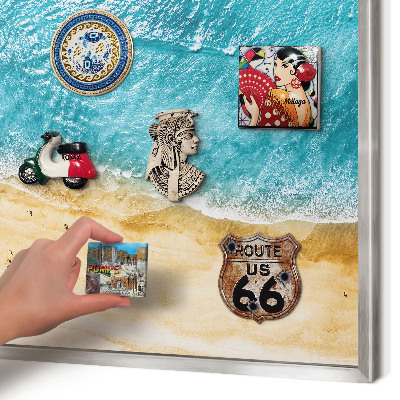 Souvenir magnet display board with a silver frame Sea and beach