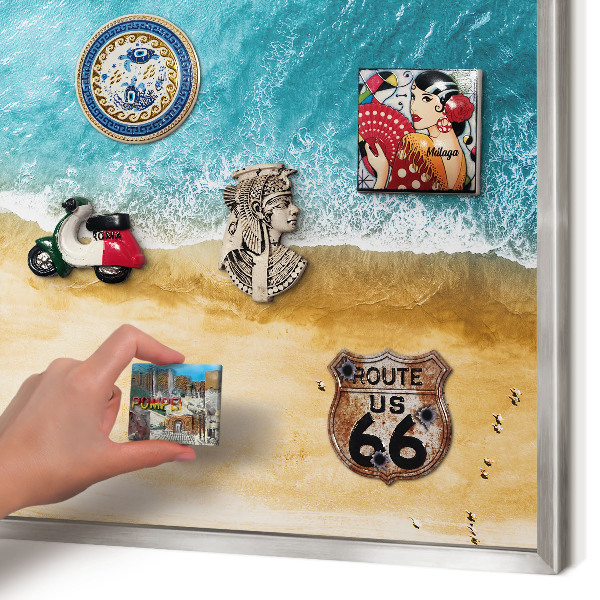 Souvenir magnet display board with a silver frame Sea and beach