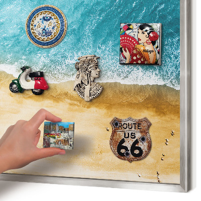 Souvenir magnet display board with a silver frame Sea and beach