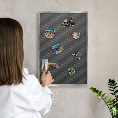 Souvenir magnet display board with a silver frame Geometric texture