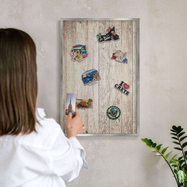 Souvenir magnet display board with a silver frame Wooden texture
