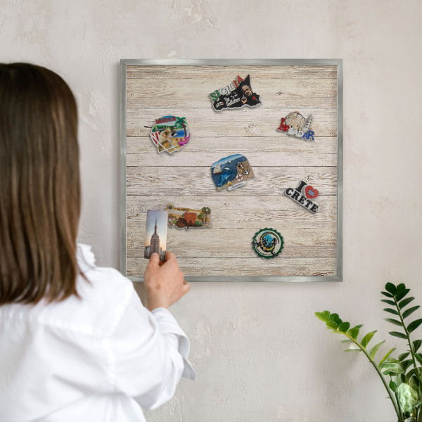 Souvenir magnet display board with a silver frame Wooden texture