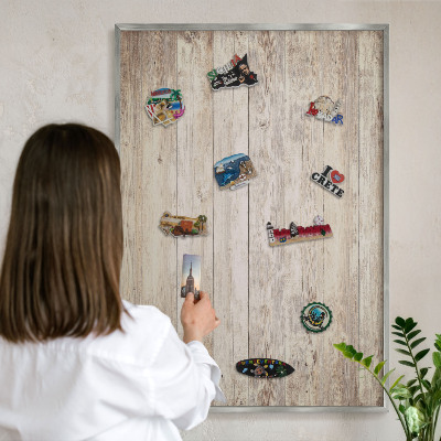 Souvenir magnet display board with a silver frame Wooden texture