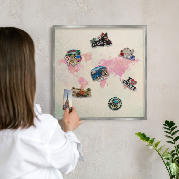 Souvenir magnet display board with a silver frame World map
