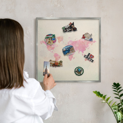 Souvenir magnet display board with a silver frame World map