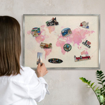 Souvenir magnet display board with a silver frame World map